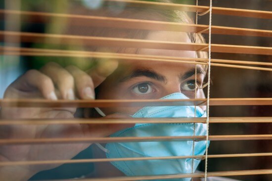 A man during lockdown wearing a mask
